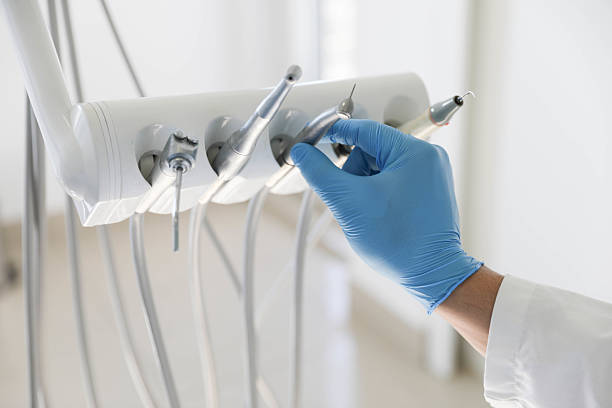 Professional Tooth Extraction technician working in Andalusia, IL
